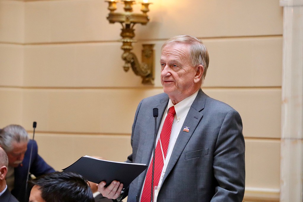 Sen. Christensen reads the names of soldiers honored on during floor time.